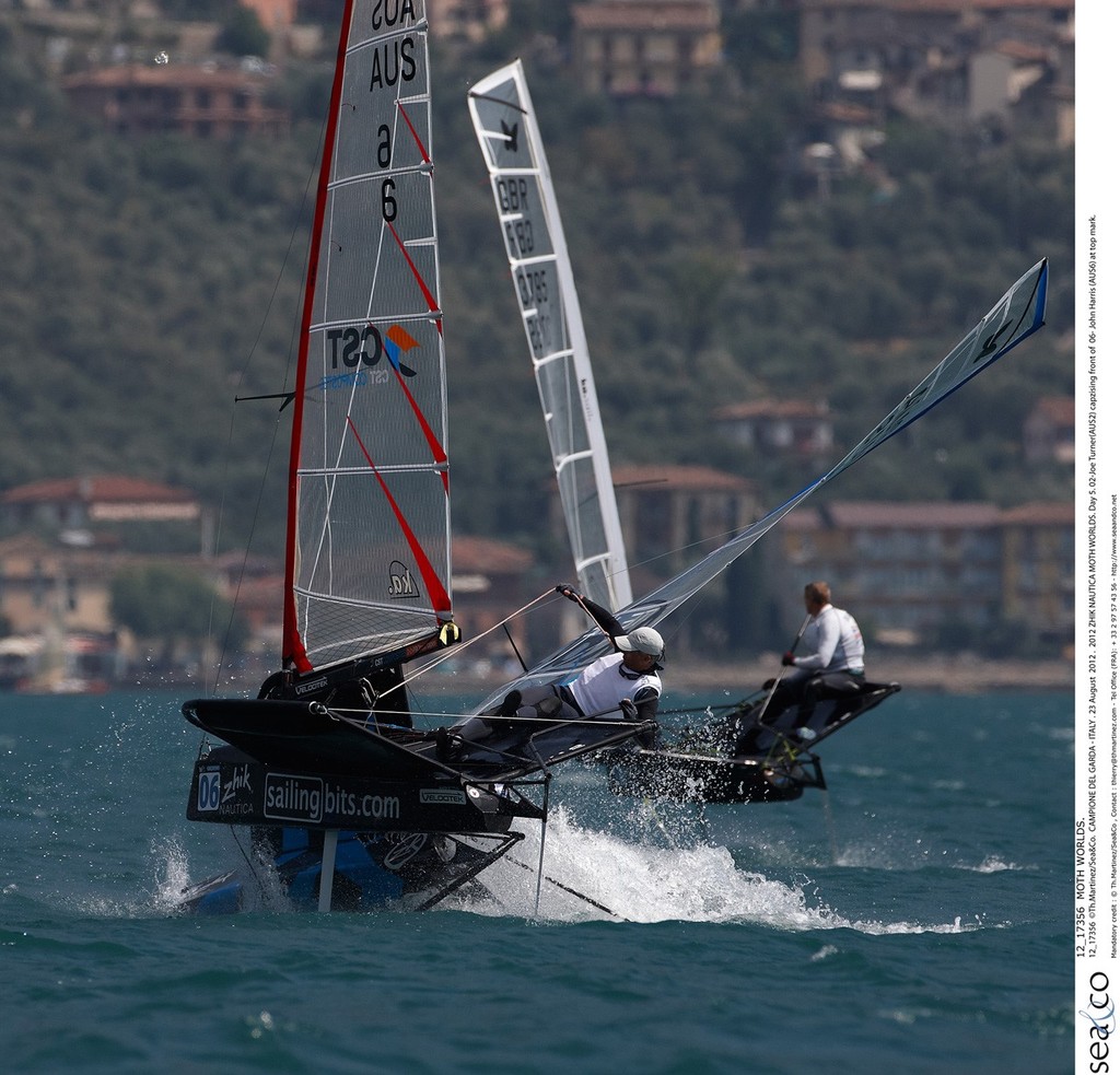 Zhik Nautica Moth Worlds - Joe Turner(AUS2) capzising front of John Harris (AUS6) at top mark. © Th Martinez.com http://www.thmartinez.com